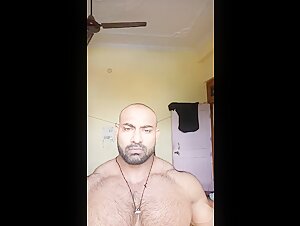 bodybuilder showing his thick muscles